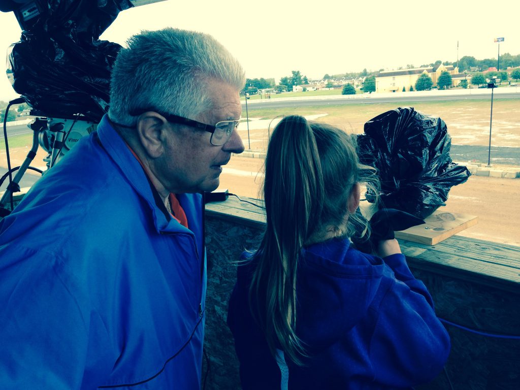 Roger Houston gives pointers to 8-year-old Morgan Marston as she calls a qualifying race at Shenandoah Downs last weekend.
