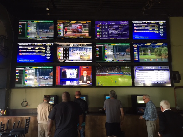 The horse racing video wall at Breakers has become quite popular with players.